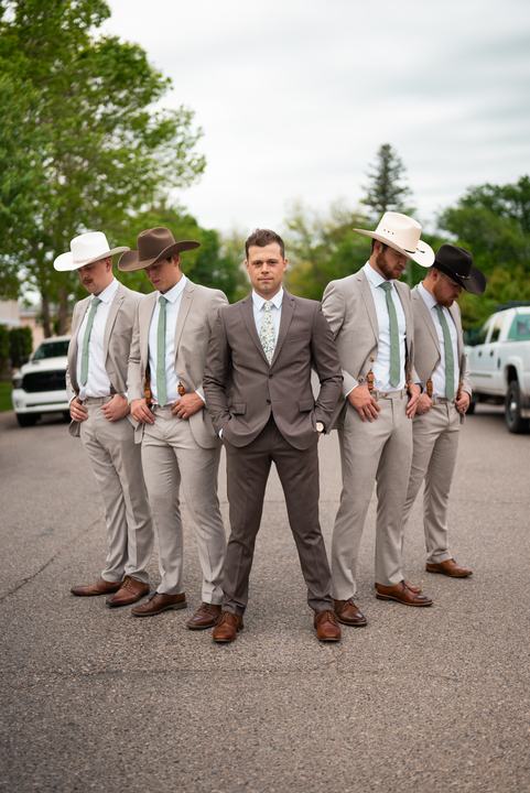 Groom and groomsmen in cowboy hats