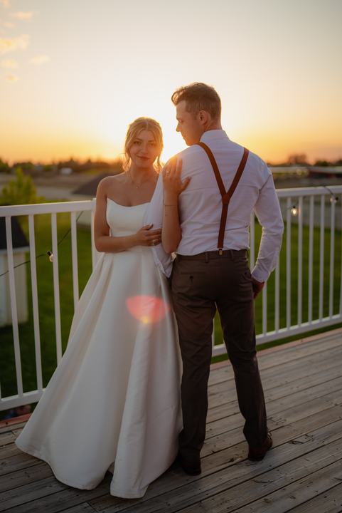 Couple on a balcony at sunset